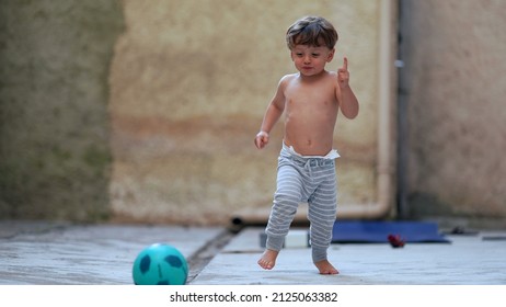 Cute Little Boy Running Outside Towards Camera