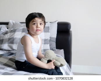 Cute Little Boy Sitting In Bed With Smiling Face And Playing Wth Teddy Bear After Finished Shower, School Boy Getting Dressed & Ready For School 