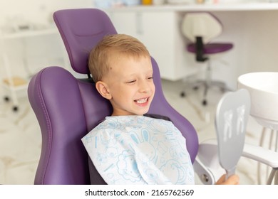 Cute little boy sitting on dental chair and smiling - Powered by Shutterstock