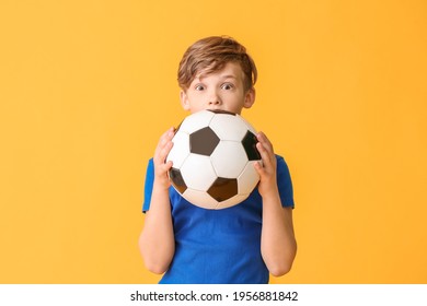 Cute little boy with soccer ball on color background - Powered by Shutterstock