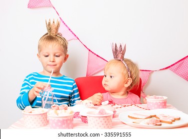 Cute Little Boy And Toddler Girl Celebrating Birthday Party