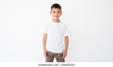 Cute Little Boy Wearing Blank White T Shirt On A White Background