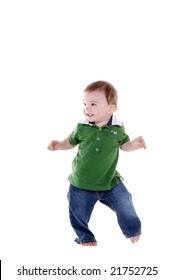 Cute little boy wearing a green top and jeans dancing.