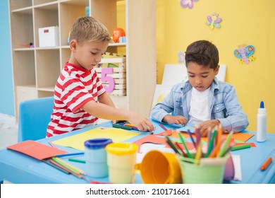 Cute Little Boys Making Art In Classroom At The Nursery School