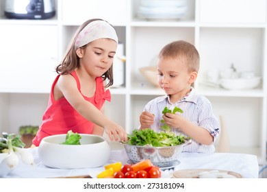 Cute Little Brother And Sister Preparing Healthy Vegan Meal