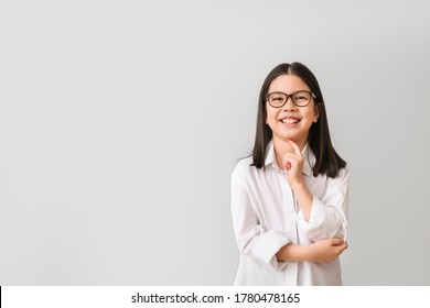 Cute Little Businesswoman On Grey Background