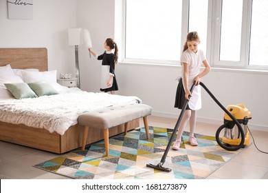 Cute Little Chambermaids Cleaning Bedroom