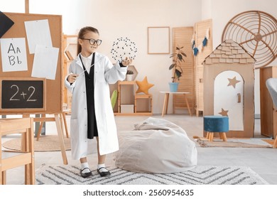 Cute little chemist with pointer and molecular model at home
