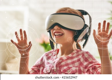 Cute Little Child Girl Playing Game In Virtual Reality Glasses.