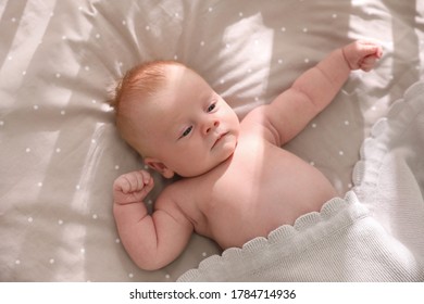 Cute Little Child Lying In Cot, Above View. Healthy Baby