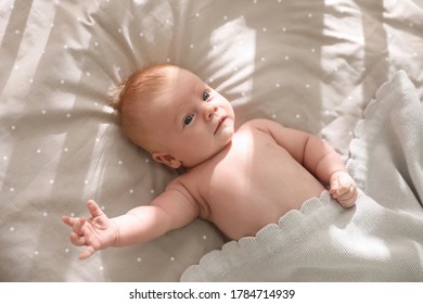 Cute Little Child Lying In Cot, Above View. Healthy Baby