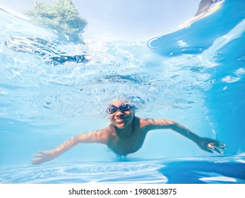Cute little child swimming in pool