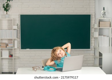 Cute Little Child Using Laptop Computer, Kid Boy Studying Through Online E-learning. Little Funny System Administrator.