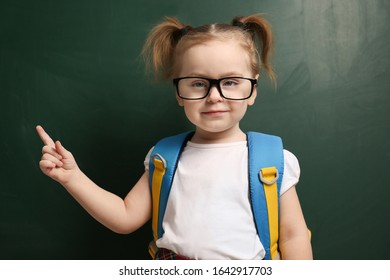 Cute little child wearing glasses near chalkboard. First time at school - Shutterstock ID 1642917703