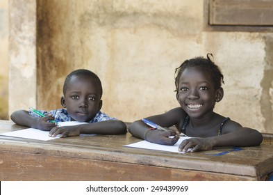 Cute Little Children Learning With Pens And Paper In Africa (Schooling Education Symbol)