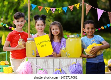 Cute Little Children At Lemonade Stand In Park. Summer Refreshing Natural Drink