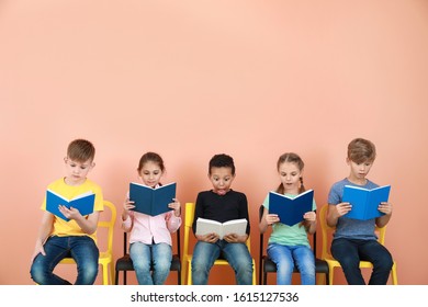 Cute little children reading books on color background - Shutterstock ID 1615127536