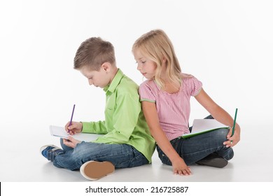 cute little children sitting floor   drawing  small girl   boy drawing picture