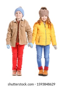 Cute Little Children In Winter Clothes On White Background