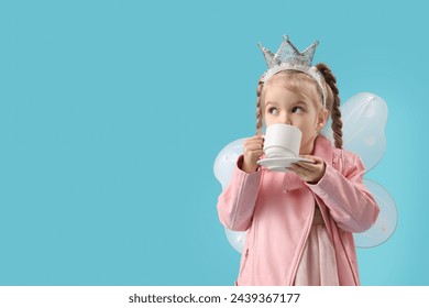 Cute little fairy drinking tea on blue background - Powered by Shutterstock