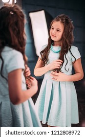 Cute Little Fashionista. Happy Child Girl Looking At Mirror.