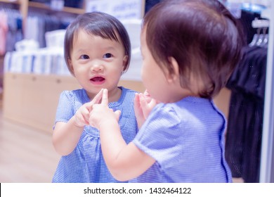 Cute Little Fashionista. Happy Child Girl Looking At Mirror. - Image