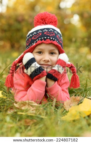 Similar – Herbstportrait eines lächelnden Kindmädchens mit Blumenstrauß aus Blättern