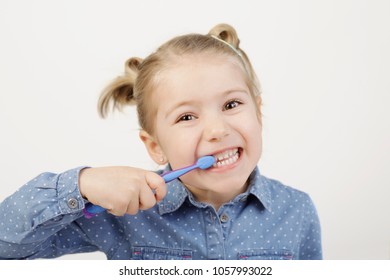 Cute Little Girl Brushing Her Teeth Stock Photo 1057993022 | Shutterstock