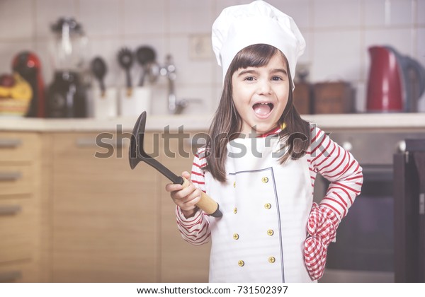 Little girl Chef In The Kitcheen...