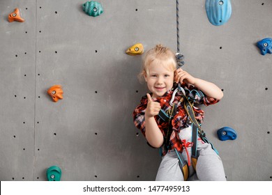 Cute Little Girl In Climbing Gym