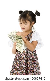 Cute Little Girl Counting Money Over White