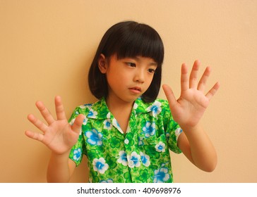 Cute Little Girl Is Counting On Fingers Of Her Hands 