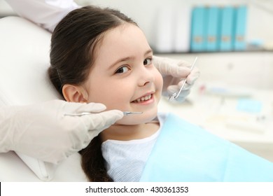 Cute little girl in the dentist chair, close up