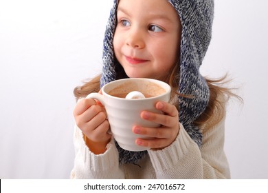 A Cute Little Girl Drinking Hot Chocolate With Marshmallow