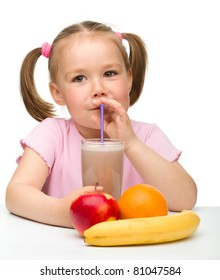 Cute Little Girl Drinks Fruit Juice Using Drinking Straw, Isolated Over White