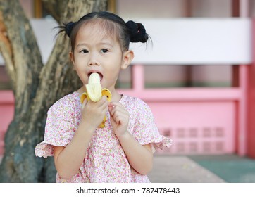 Cute Little Girl Eating Banana Park Stock Photo (Edit Now) 787478443