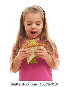 Cute Little Girl Eating Tasty Sandwich On White Background