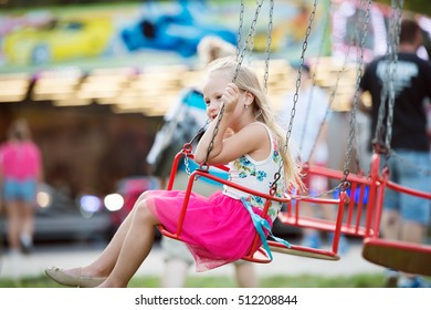 Cute Little Girl At Fun Fair, Chain Swing Ride