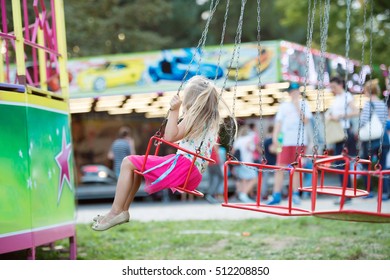 Cute Little Girl At Fun Fair, Chain Swing Ride