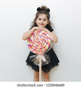 Cute Little Girl With Giant Lollipop