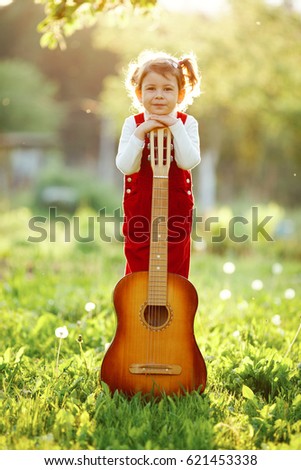 Similar – Image, Stock Photo Girl with a guitar in the green grass