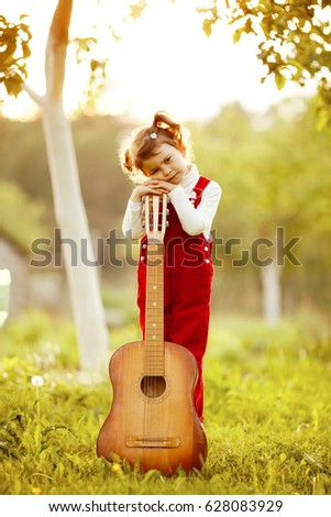 Similar – Image, Stock Photo Girl with a guitar in the green grass