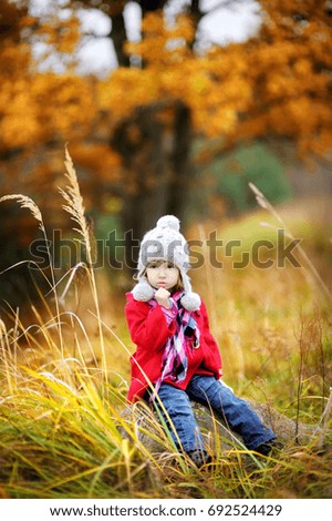 Similar – Foto Bild fröhlich lustiges Kind Mädchen isst frischen Apfel im Herbst