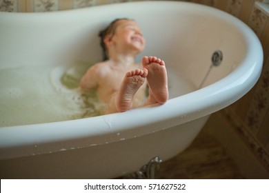 Cute Little Girl Having Warm Bath At Home