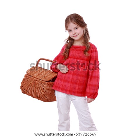 Cute little girl holding a basket/caucasian  cute girl holding a picnic basket on white background