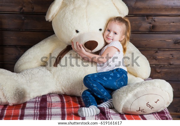 girl with giant teddy bear