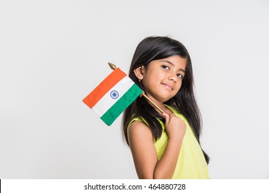 Cute little girl with Indian National Tricolour Flag, Isolated over white background. Suitable for Independence Day or Republic Day concept