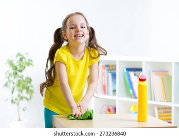 Cute Little Girl Make Cleaning In The Children Room At Home