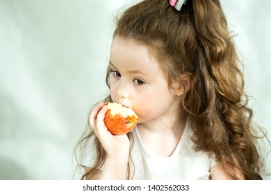 Cute Little Girl Nibbles Apple Pleasure Stock Photo (Edit Now) 1402562000