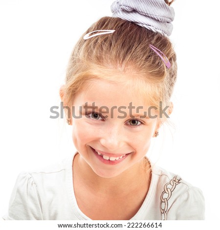 Cute little girl on a white background close-up